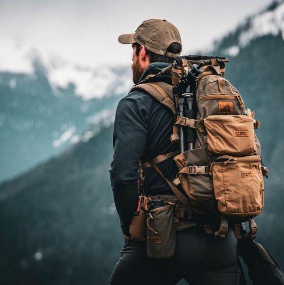 Climber at Kilimanjaro summit at sunrise
